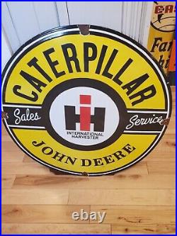Caterpillar IH John Deere sign