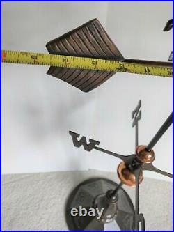 Decade old Decorative John Deere Design Weather Vane on a weighted metal stand