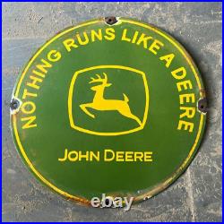 Vintage JOHN DEERE -Nothing Runs Like A Deere Rusted Porcelain Sign